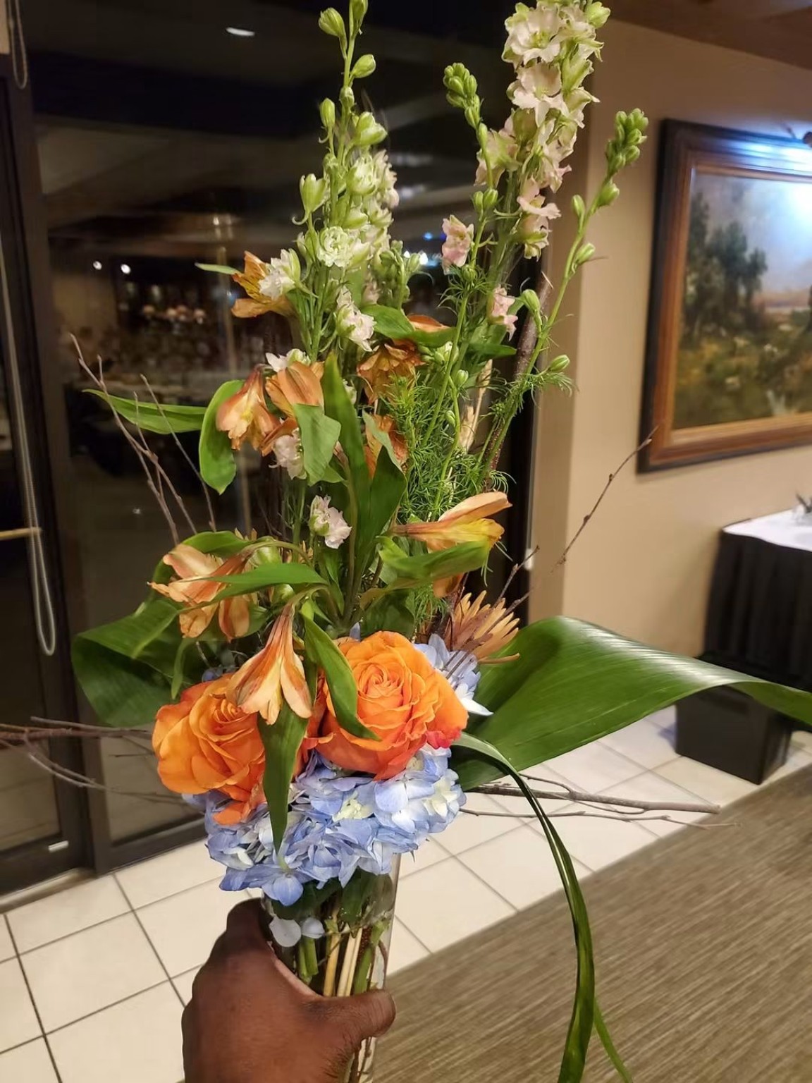 Tall floral arrangement prepared for an event