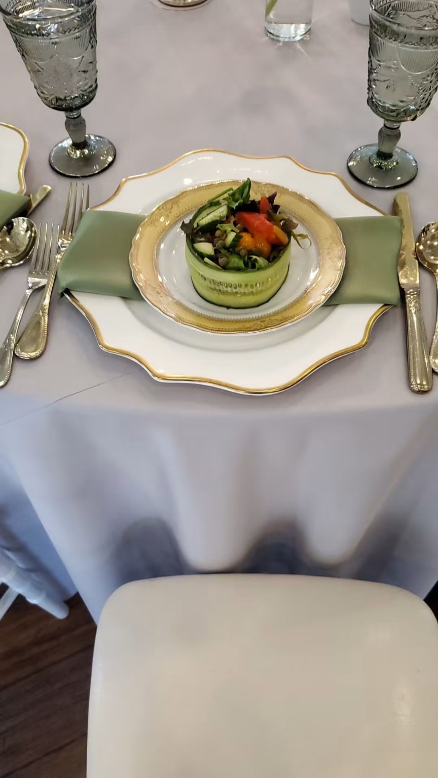 Fresh salad presented on a formal place setting