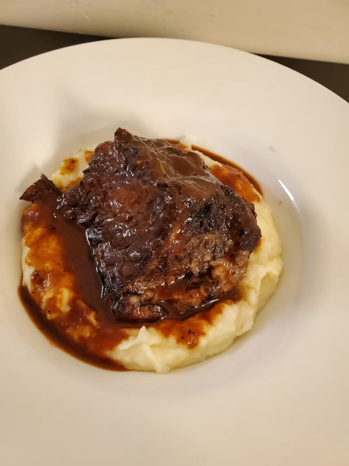 Plated entrée with sauce and seasonal sides