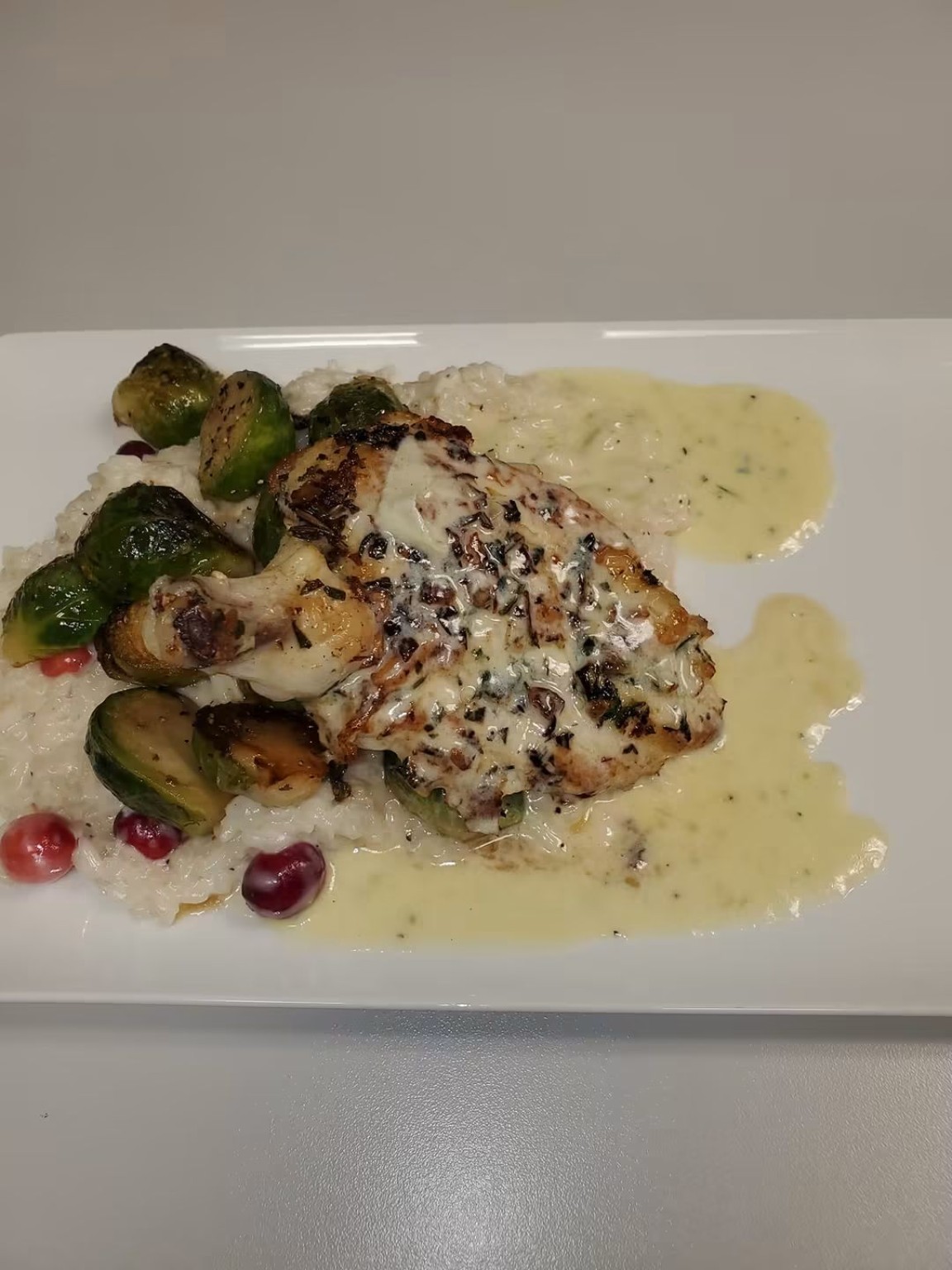 Chicken with creamy sauce rice and seasonal vegetables