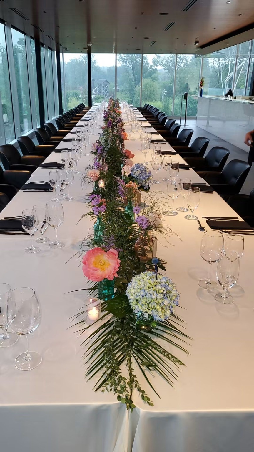 Long dining table with floral runner