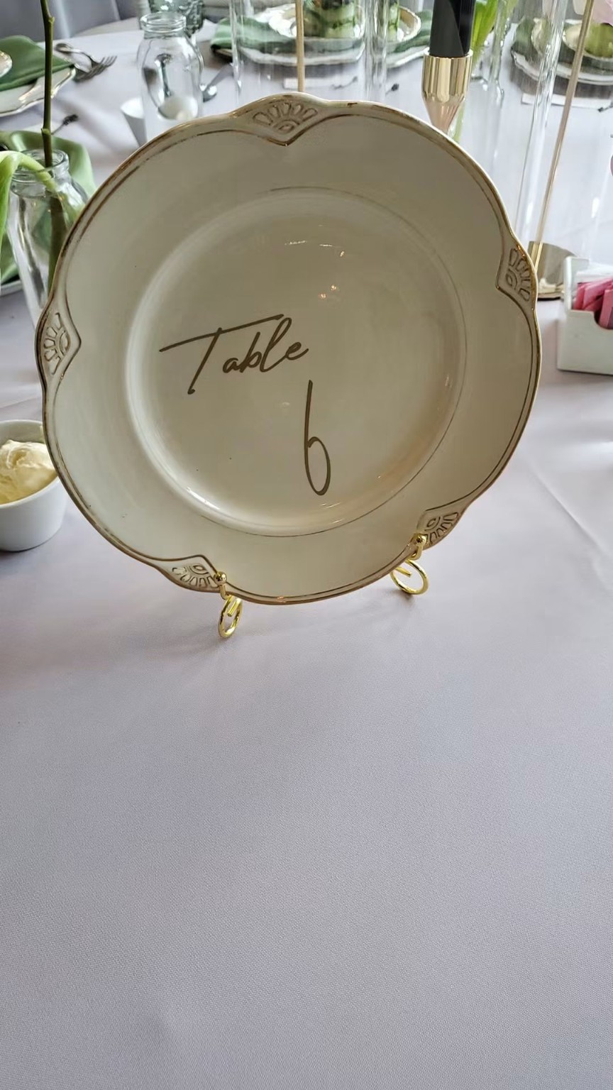 Decorative table marker plate on a formal table
