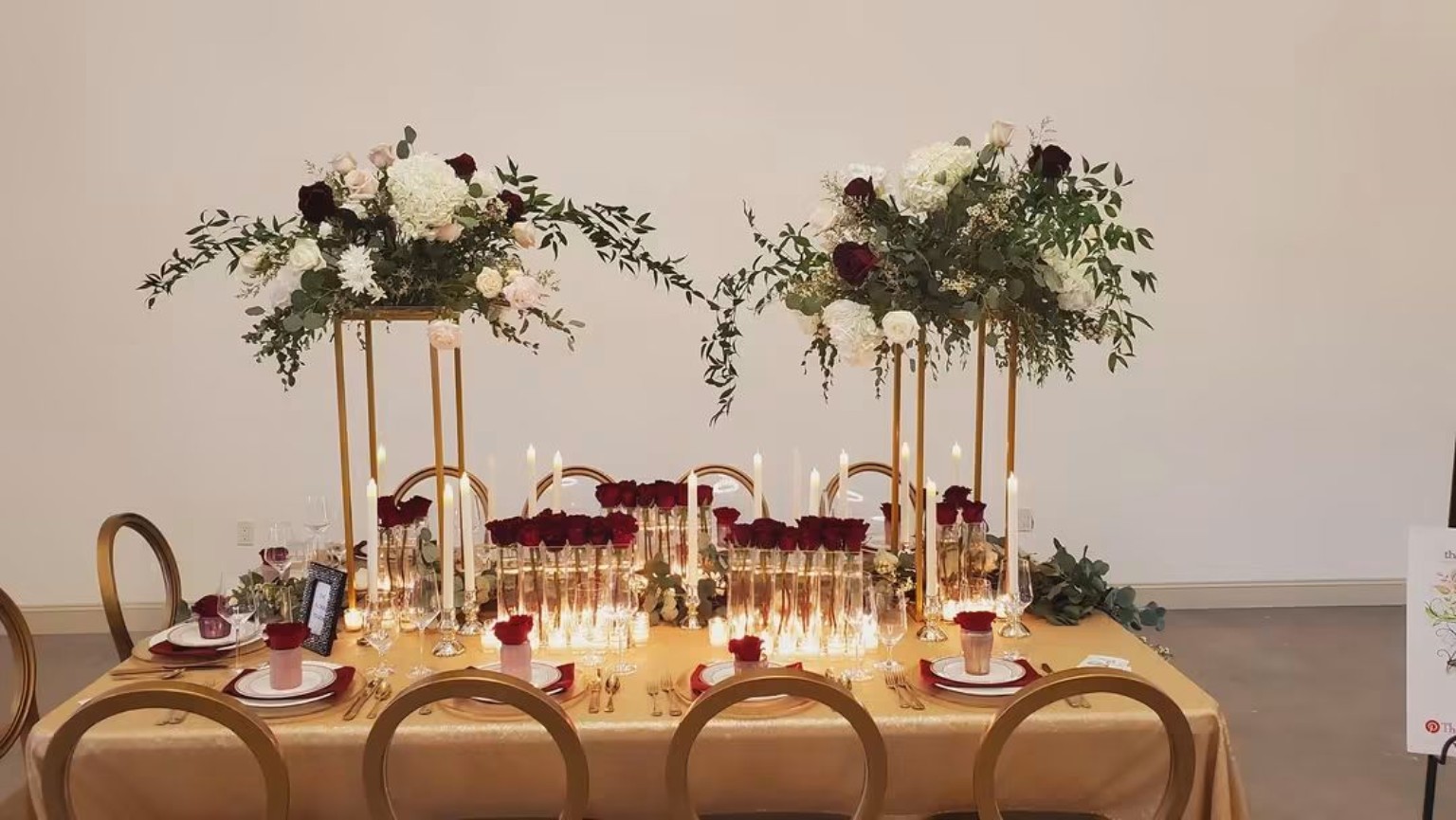 Formal wedding table with tall floral arrangements