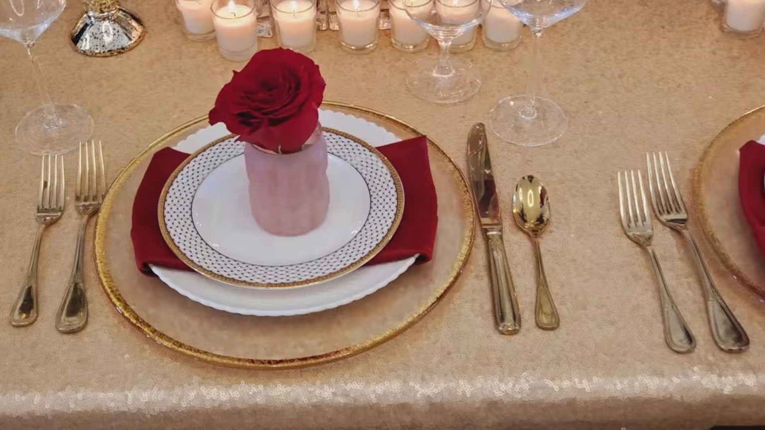 Red rose place setting on a formal table