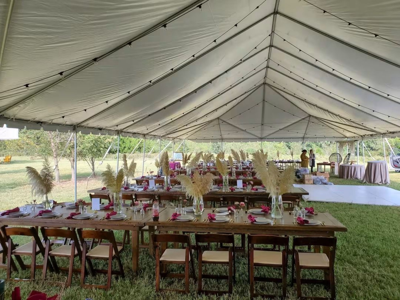 Outdoor tent reception with dining tables