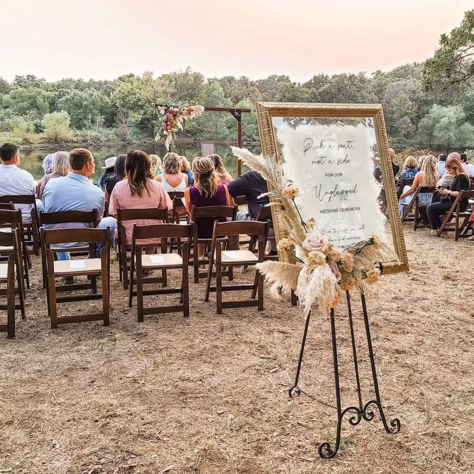 Outdoor ceremony setting with a welcome sign