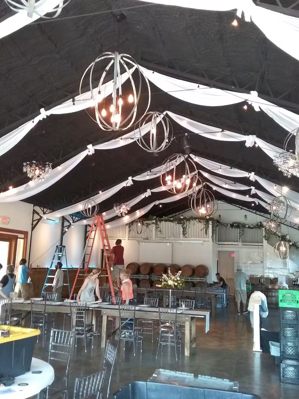 Event room with draped ceiling and warm lighting